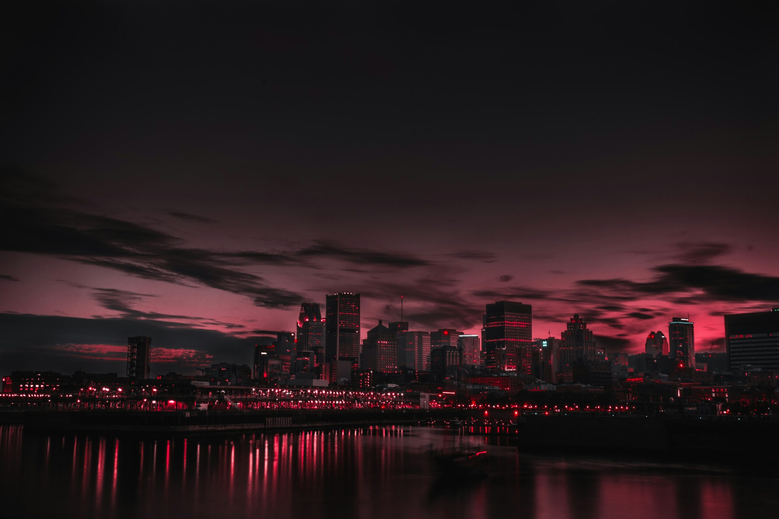 Gotham city at dusk glowing red.